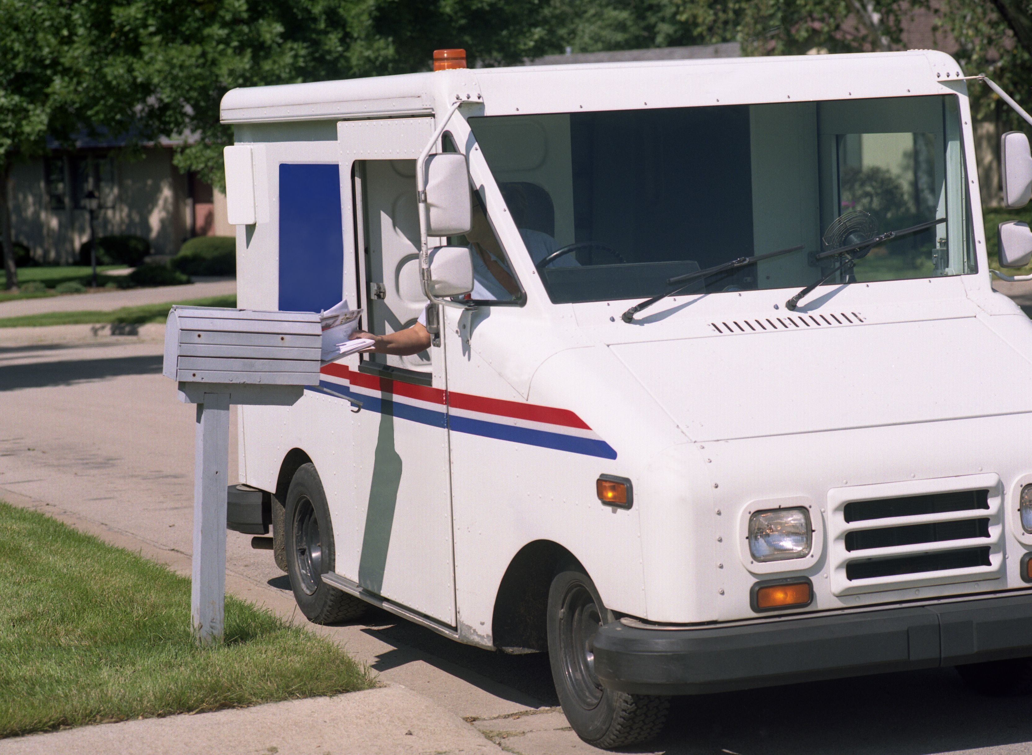 LLV delivering mail