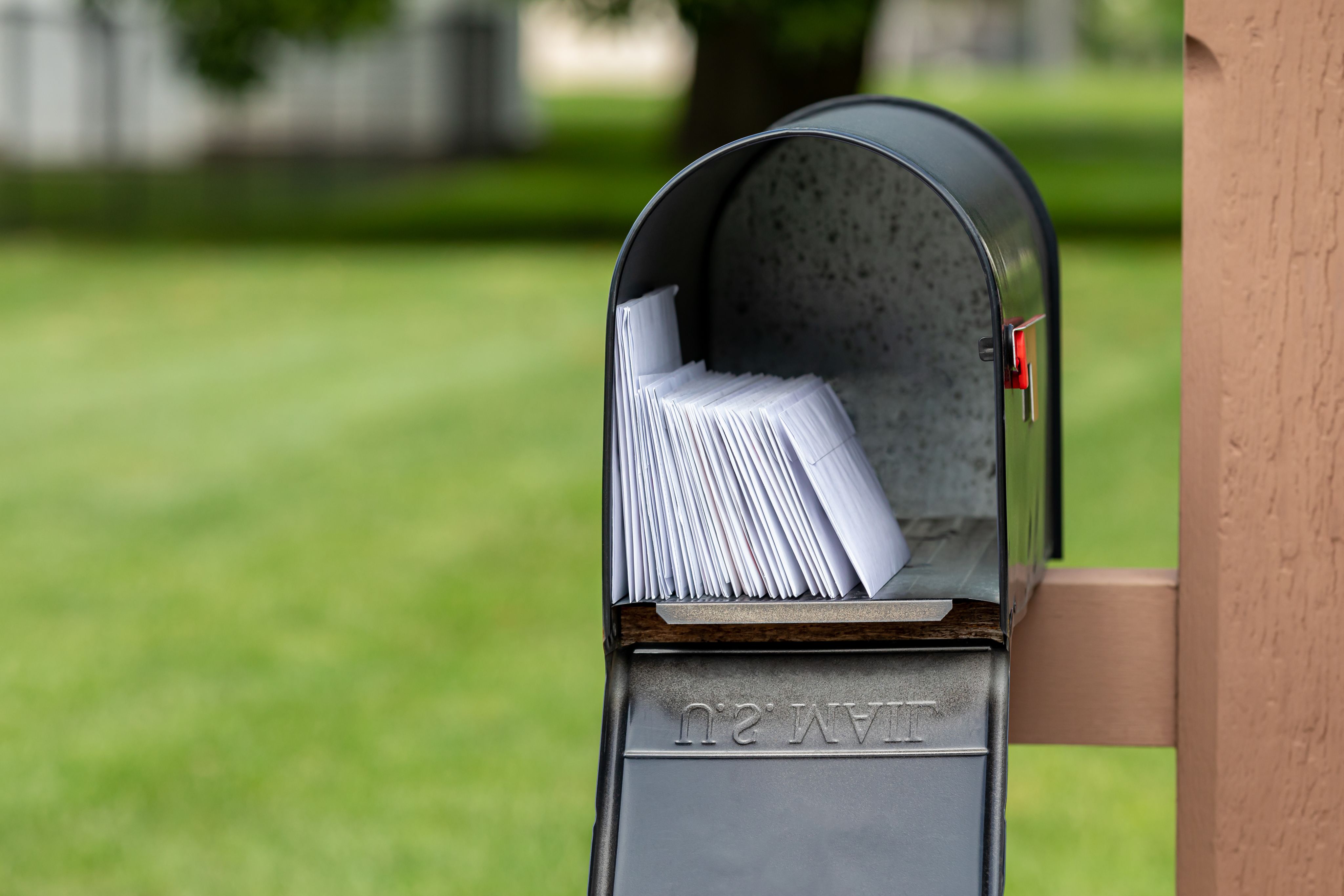 six assorted-color mail boxes